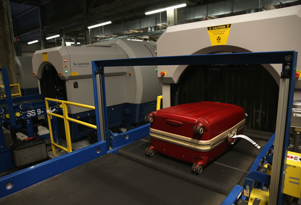 A 2014 photo shows luggage moving through an explosives detection system at the Newark Liberty International Airport in New York City.