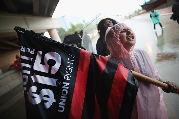 Demonstrators calling for an increase in the minimum wage to $15-dollars-per-hour march to McDonald's corporate headquarters during a protest on May 25 in Oak Brook, Illinois.