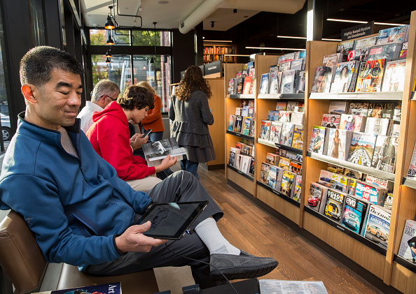 Jeff Ing of Seattle uses a Kindle Fire tablet device at the newly opened Amazon Books store on November 4, 2015 in Seattle, Washington. The online retailer opened its first brick-and-mortar book store on November 3, 2015.