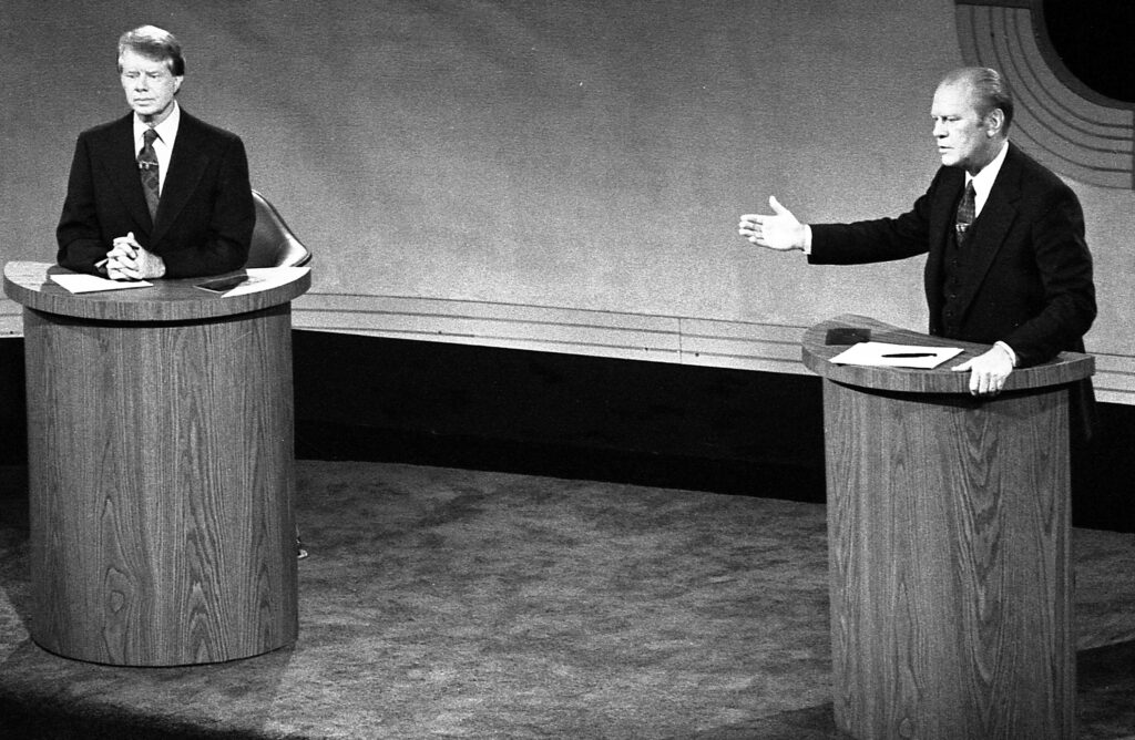 President Gerald Ford and Jimmy Carter meet at the Walnut Street Theater in Philadelphia to debate domestic policy during the first of the three meetings in 1976. Presidential candidates have squared off in televised debates every election since then. 