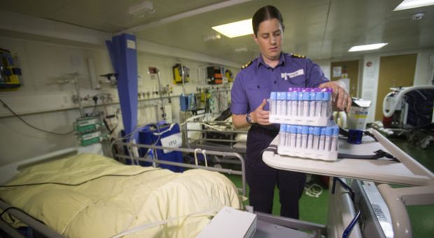 Lt Susan Jeffreys checks medical equipment in the ship's hospital on board RFA Argus as it prepares to leave its home port of Falmouth for Sierra Leone on October 14, 2014 in Cornwall, England. The medical ship with a fully-equipped 100-bed hospital on board is currently being loaded to be sent to Sierra Leone, along with three Merlin helicopters to help in the fight against Ebola. The vessel, which is due to set sail on Friday, will not be used to treat Ebola-infected patients, but mainly to transport supplies and to ferry personnel. 